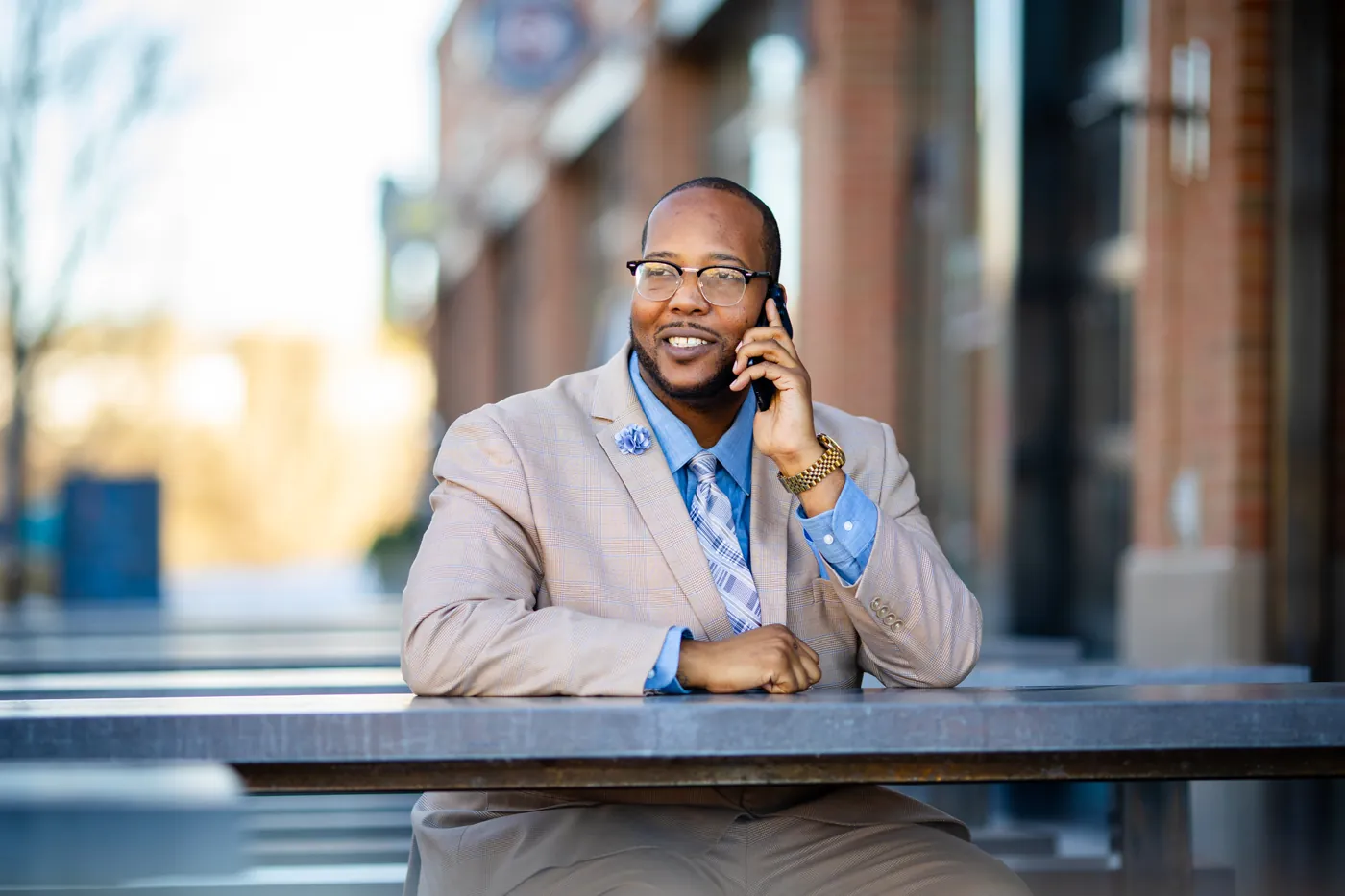 A DG Lending loan officer on a call outside the office